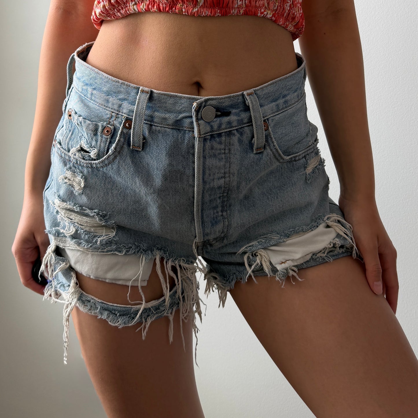 Levi’s Light Wash Distressed Denim Shorts - W24