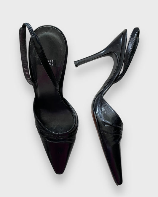 Black high-heeled shoes on a white background