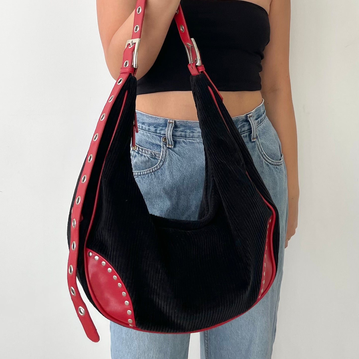 T...T Black Moon Shaped Corduroy Bag with Red Straps and Silver Grommets