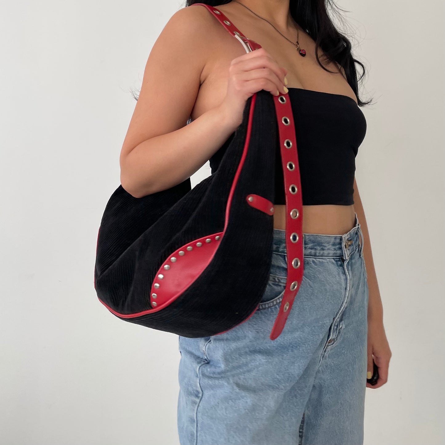 T...T Black Moon Shaped Corduroy Bag with Red Straps and Silver Grommets