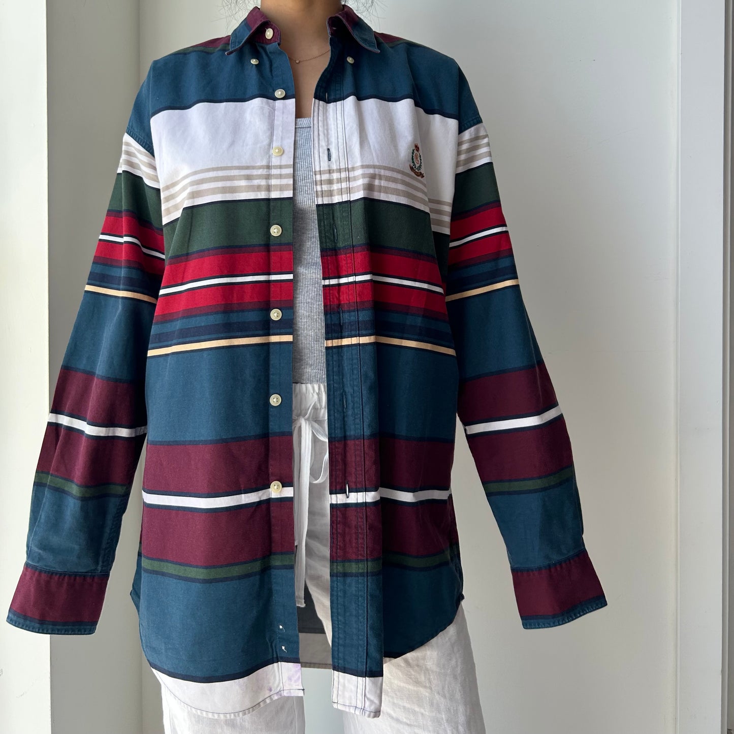 Multicolored striped shirt with a plain background