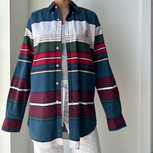 Multicolored striped shirt with a plain background